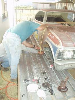 Earl and Kevin measure the nose for proper placement of cut