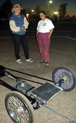 That's Laurie explaining new additions - a Pat Foster-built fuel tank and a little airfoil. She still needs a pair of period rear wheels to complete the look of her little car