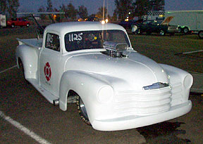 I discovered this plastic pickup in the pits. It's Pro Mod style, with nearly 600ci under that wedged hood. Owner was shaking it down